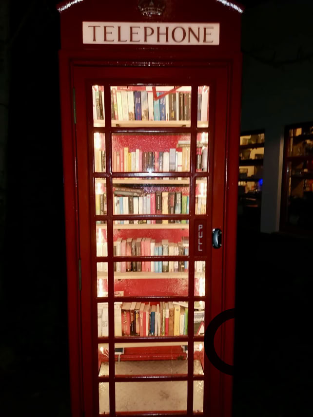Red British Telephone Box as a Log Shop
