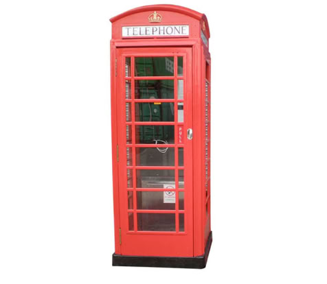 A red British telephone booth with glass paneled doors and a "TELEPHONE" sign at the top.