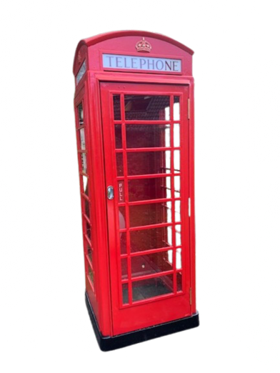 A red British telephone booth with glass paneled windows and a curved top.